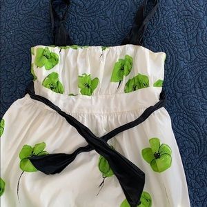 Sleeveless white, green, & black poppy print dress